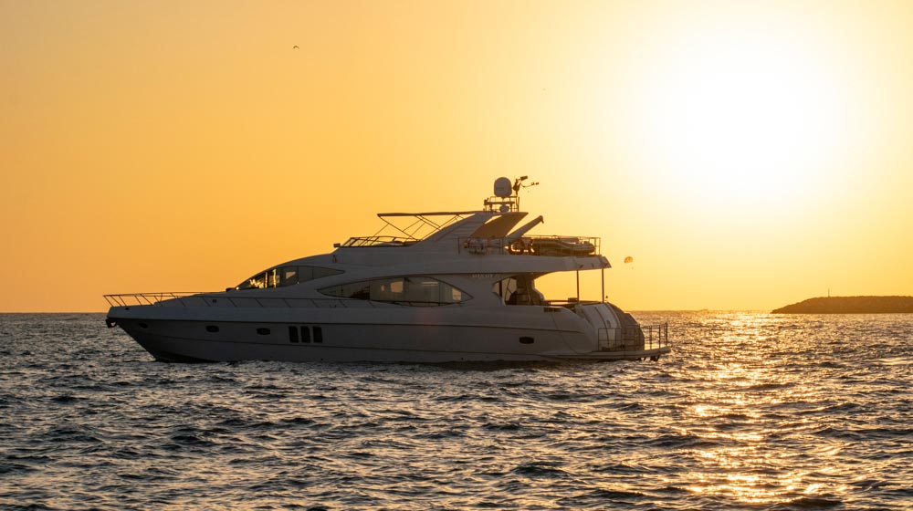 77ft yacht Dionysos cruising in Arabian gulf during sunset
